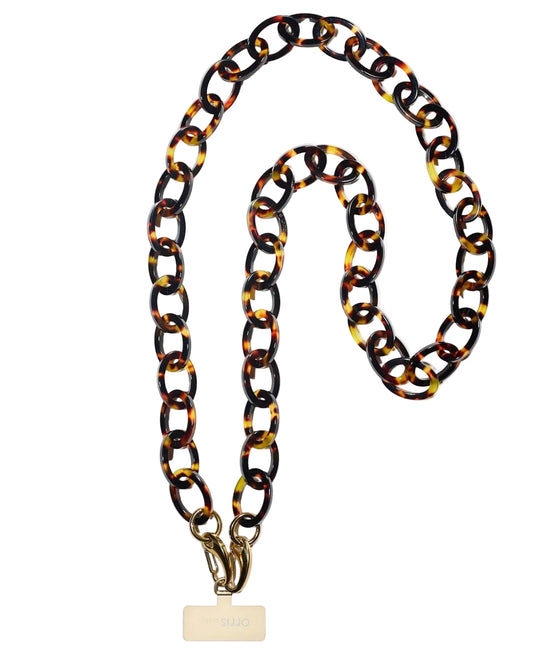 Tortoiseshell chain necklace with a gold tag on a white background phone strap bio-acetate