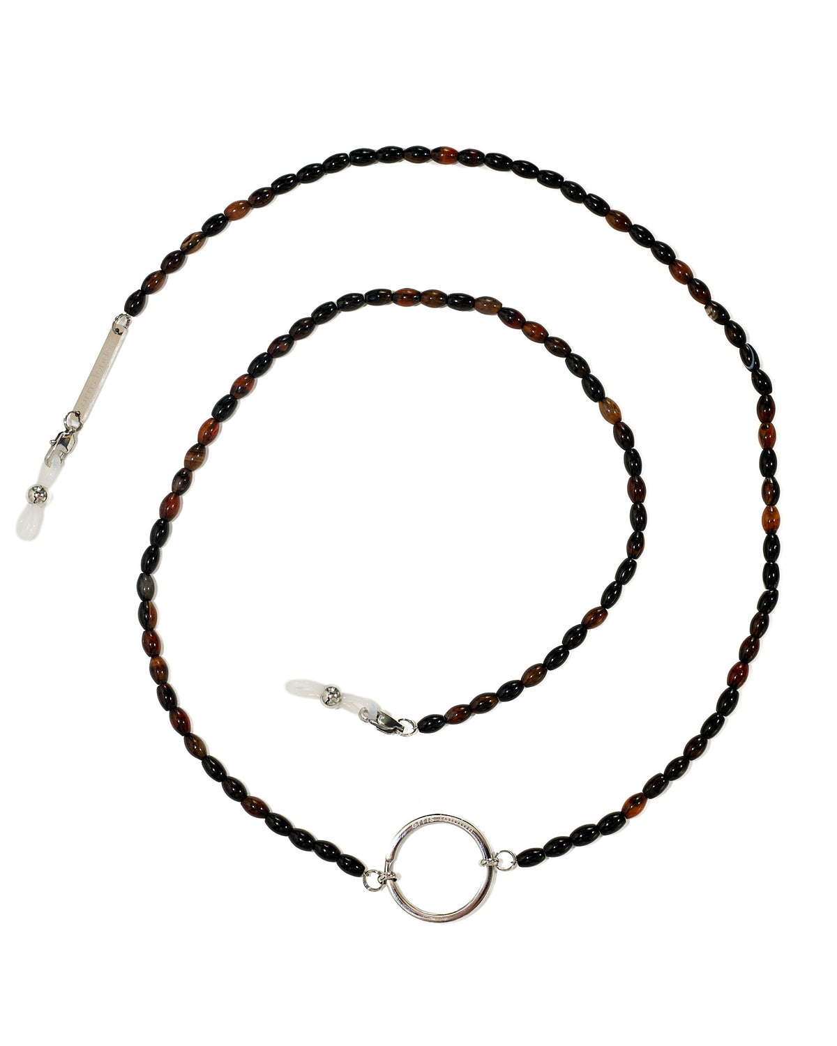 A beaded necklace with alternating dark brown and black beads, featuring a polished silver-tone circular ring at the center, a silver bar clasp, and a white stone accent on a white background.